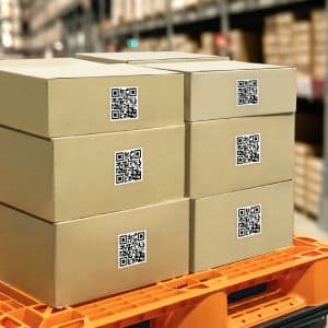 A stack of boxes with QR codes on them